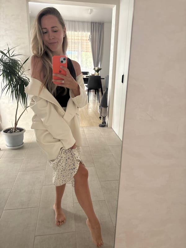 Mirror selfie session in a Chaikovsky room, floral skirt and blazer
