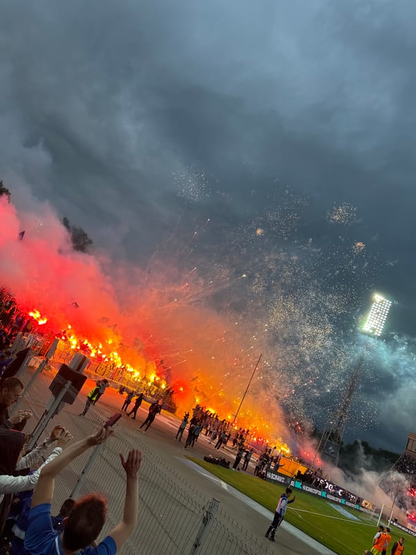 Soccer fans create flare display at stadium