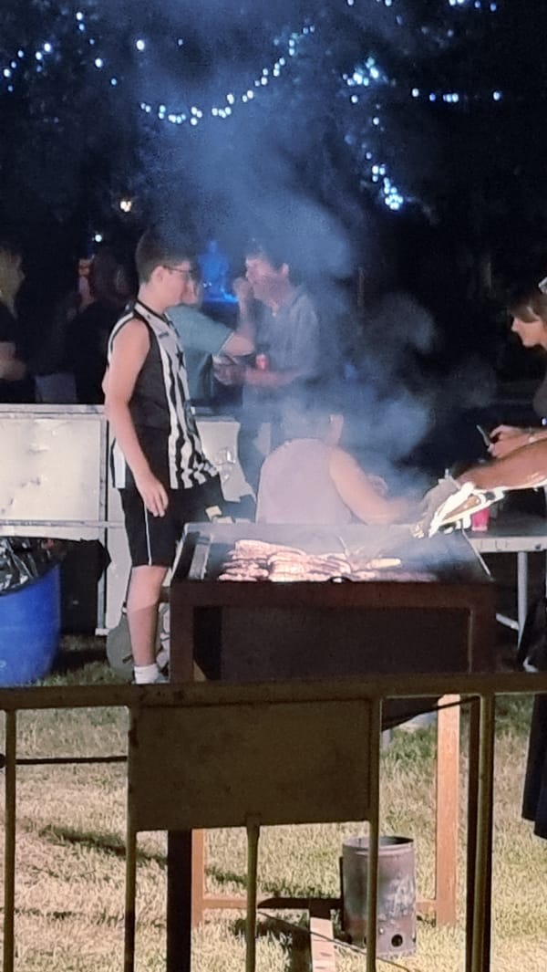 Late-night barbecue under string lights in Sant Joan Les Fonts