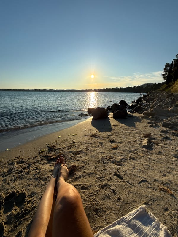 Woman enjoys sunset beach session in Nesebar, Bulgaria