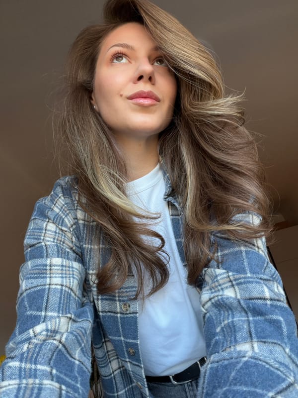 Woman takes bathroom selfie in Riga, Latvia