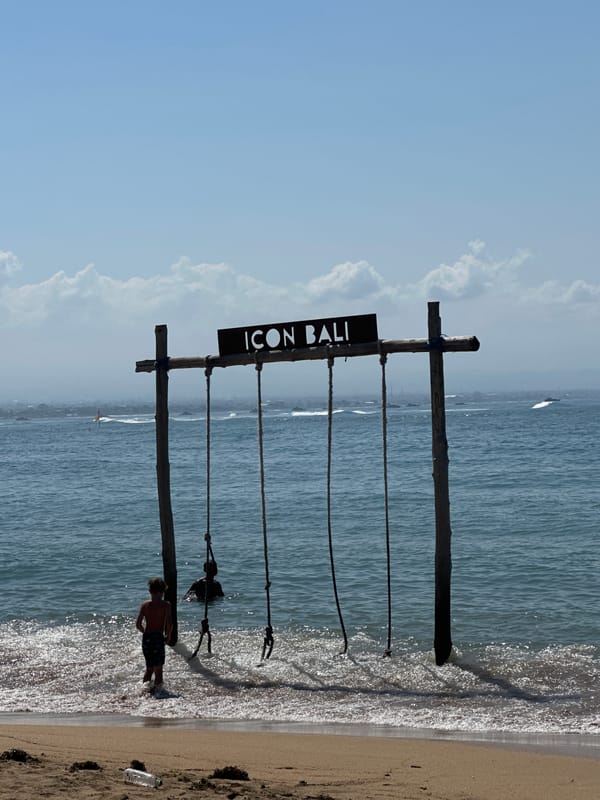 Beach, resort, and street-level snapshots around Denpasar, Bali