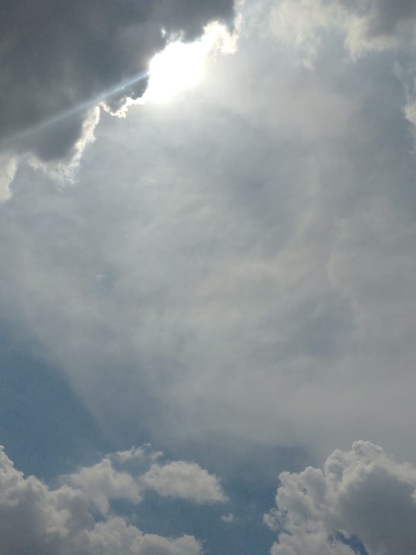 Sunlight breaks through grey clouds over Tinaquillo, Venezuela