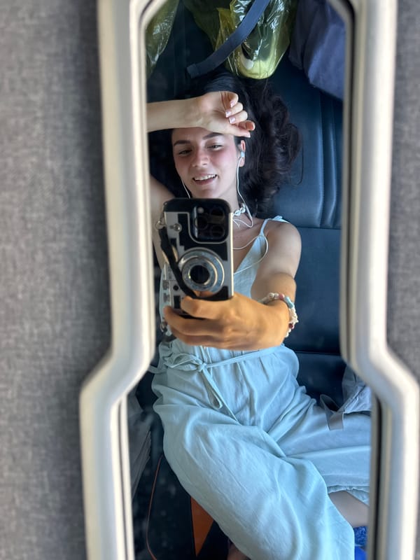 Woman takes mirror selfie on Vietnam public transport