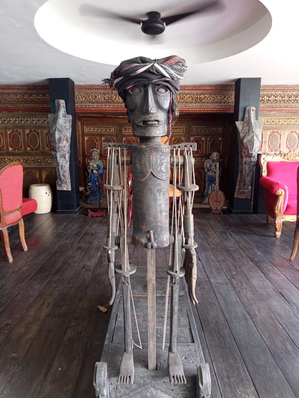Tourist explores Indonesian cultural artifacts and art in North Kuta