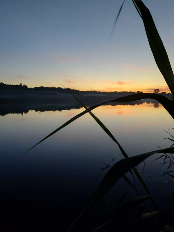 Summer solstice dusk along the waterfront in Ustyvytsia, Ukraine