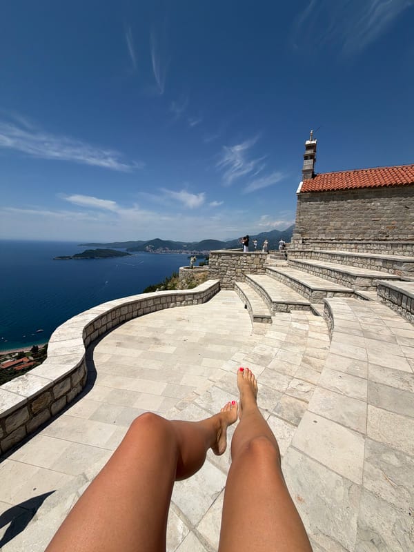 Wedding ceremony held on Sveti Stefan clifftop overlooking Adriatic Sea