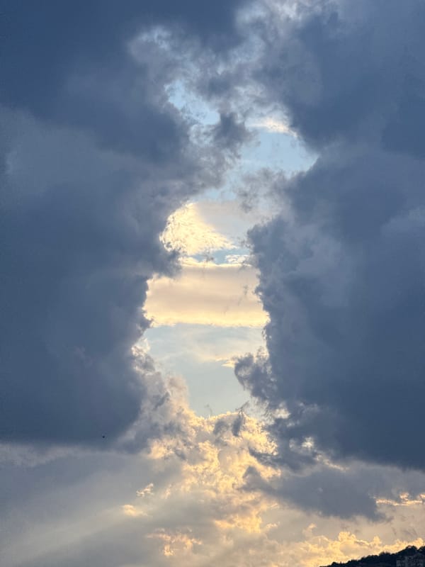 Dramatic storm clouds and sunlight documented over historic Veliko Tarnovo