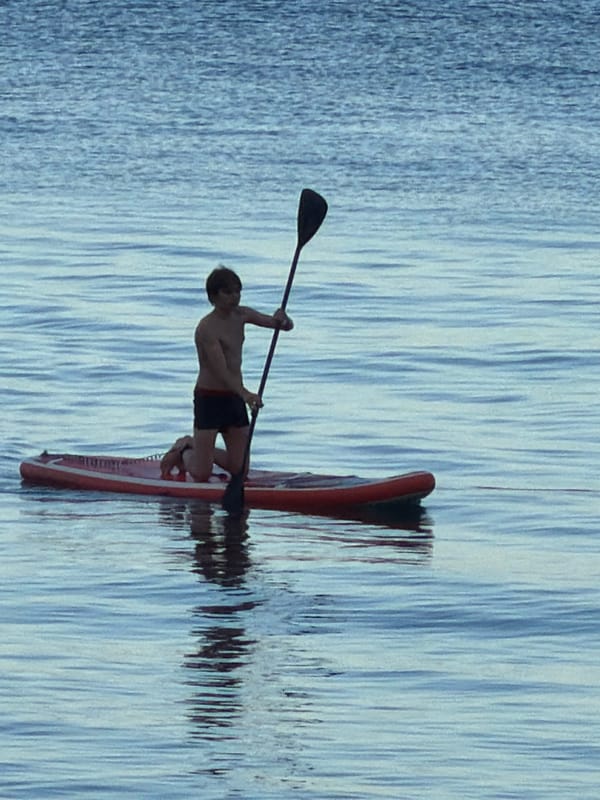 Lazy beach afternoon in Partenit: paddleboarding, promenade life, good vibes
