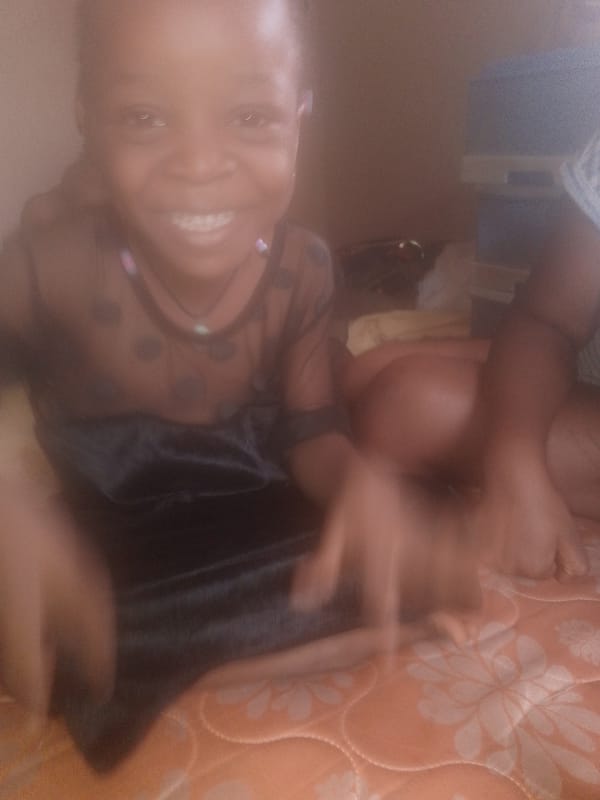 Children observed resting on orange patterned surfaces indoors