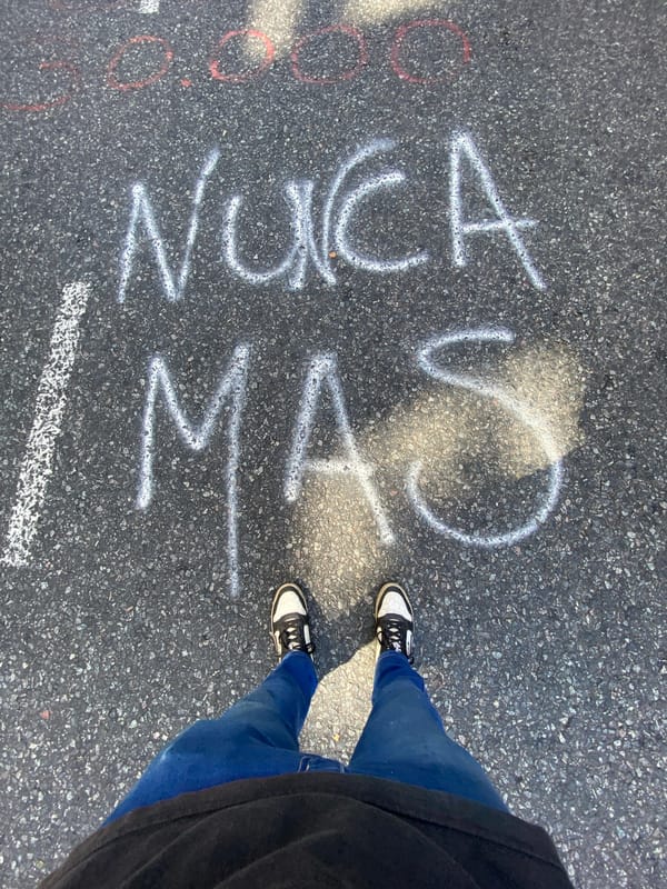 Street scenes documented in Buenos Aires show pavement text, building entrance