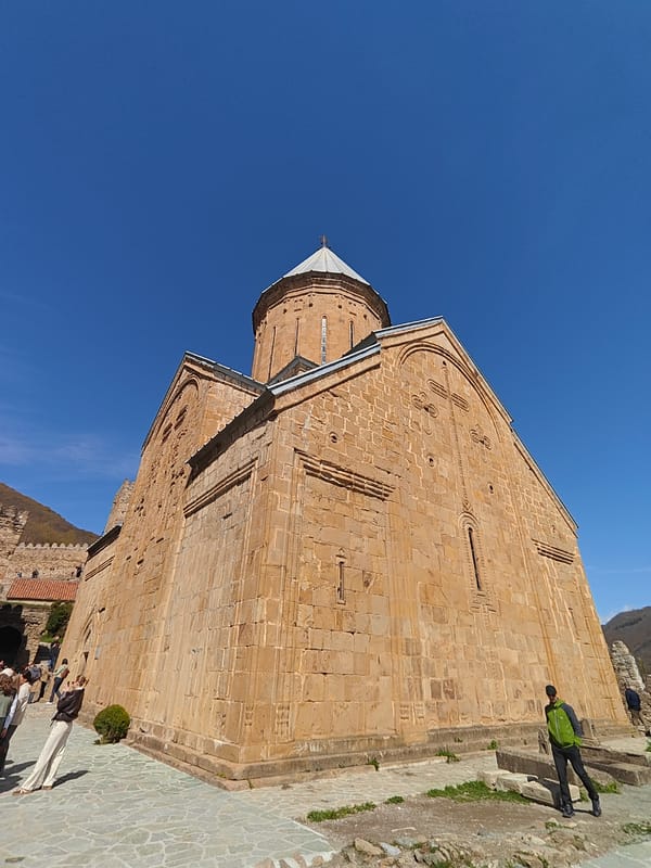 Historic Ananuri Fortress photographed under clear Georgian morning sky