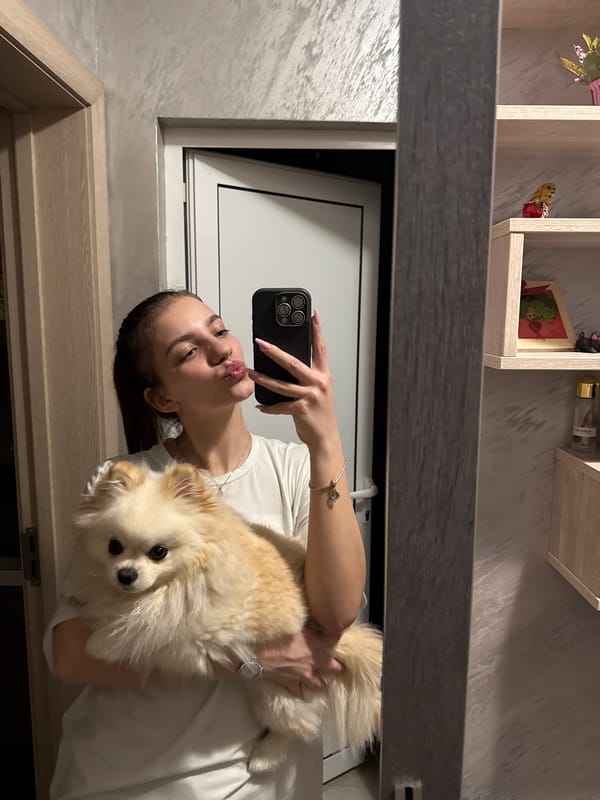 Woman takes selfie with Pomeranian dog in Bulgaria