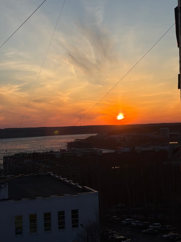 Afternoon scenes documented across Izhevsk including sunsets and cathedrals