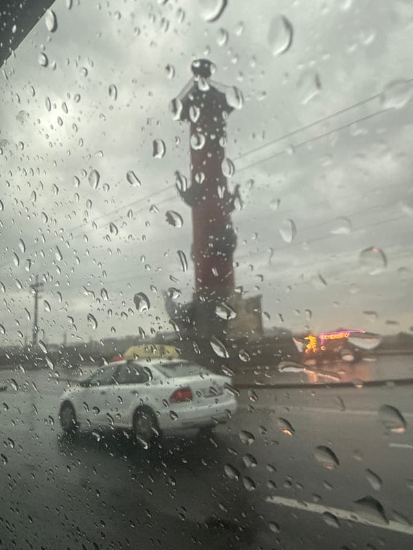 Rainy night drive past Saint Petersburg's historic landmarks