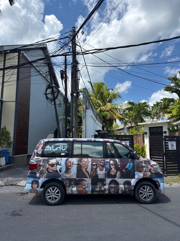 Advertising-wrapped minivan spotted on North Kuta street