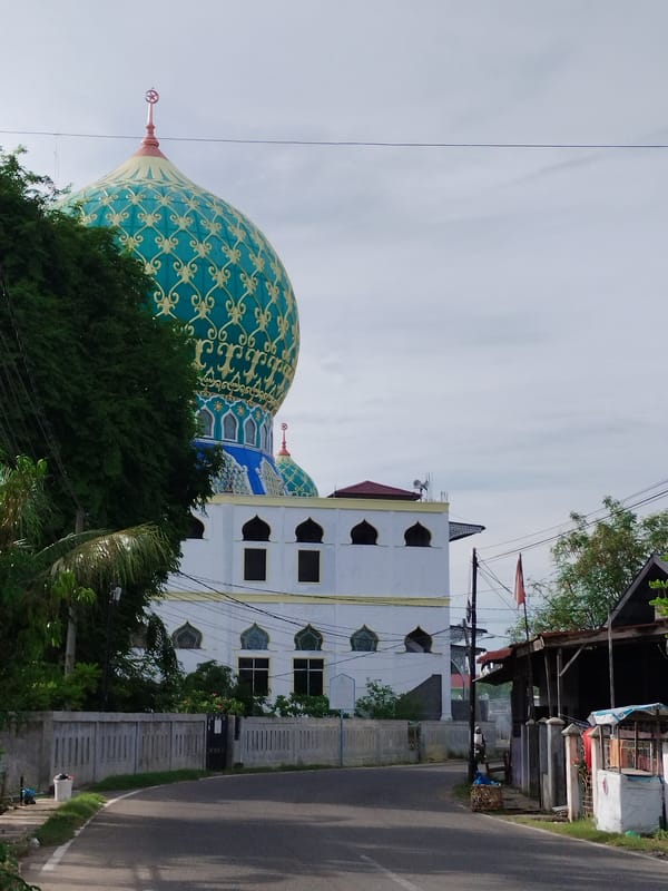 Mosque with ornate turquoise dome observed in Lhokseumawe, Indonesia