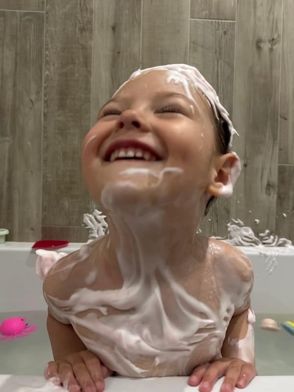 Child's bath time captured in Zelenogradsk bathroom