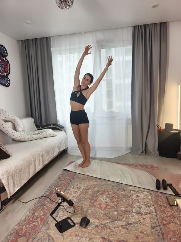 Home yoga session on a mat in Tyumen, Russia