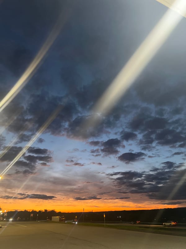 Dramatic sunset illuminates clouds over Amsterdam, New York