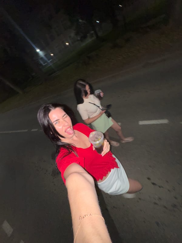 Late-night hangout with drinks and selfies in Chaikovsky