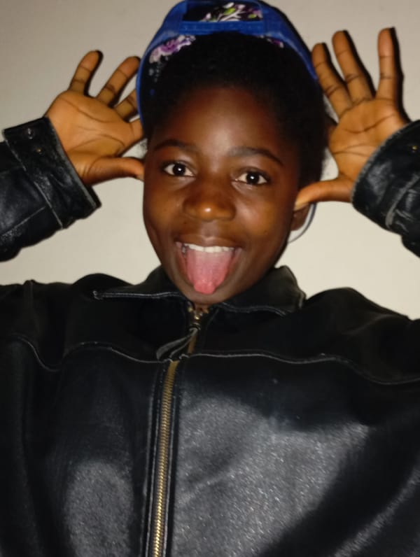 Young person makes playful expressions in leather jacket