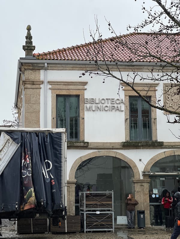 Tourist documents rainy afternoon walk through historic Bragança, Portugal