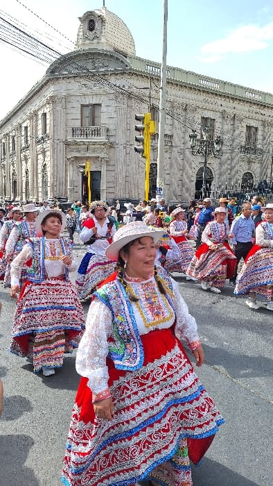 Traditional Peruvian festival parades through Arequipa streets with dancers