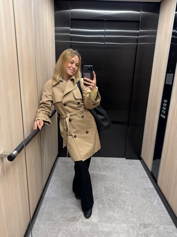 Woman takes elevator selfie in Riga, workplace social media suggested
