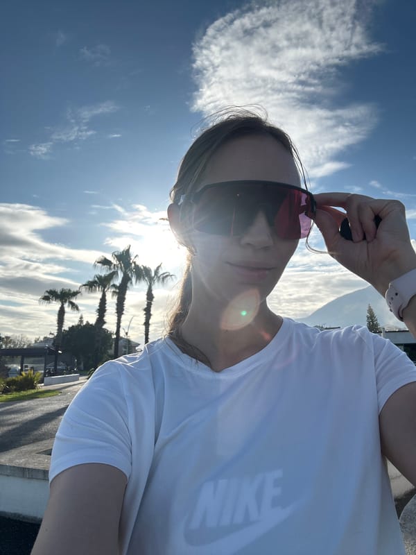 Woman documents morning stroll through Fethiye harbor with stroller