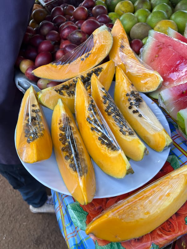 Street vendors sell fresh produce in Nyeri marketplace