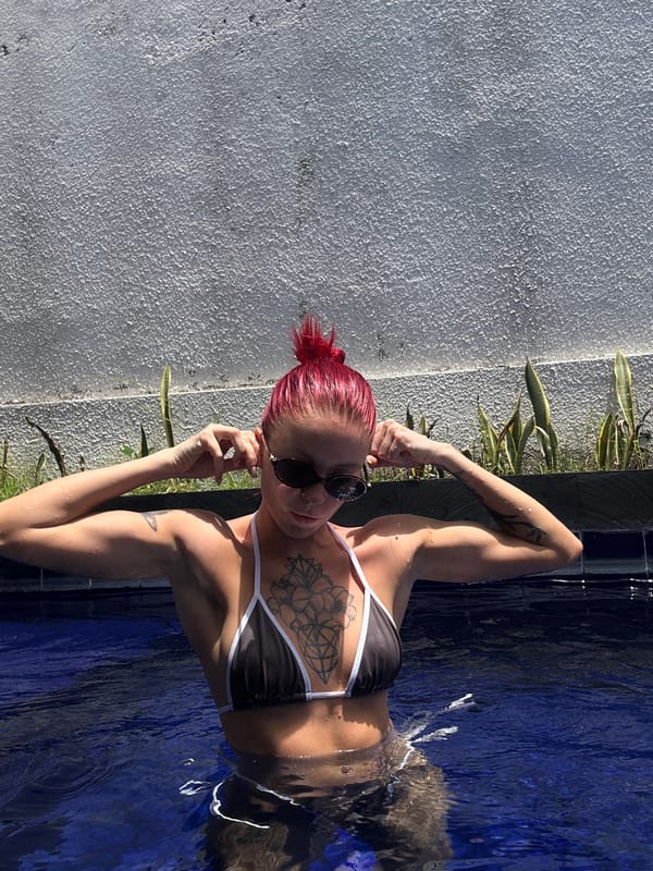 Woman swimming in pool in Dalung, Indonesia