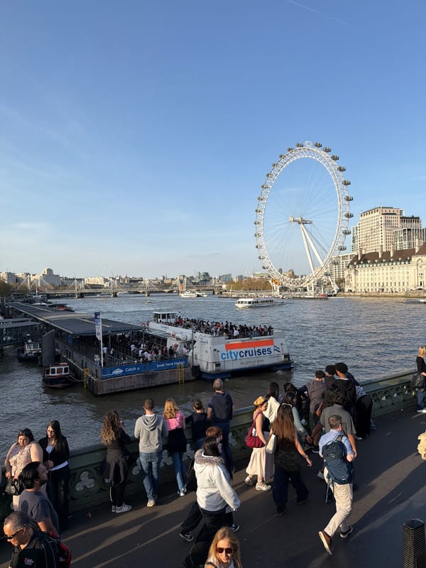 Red tour bus carries passengers through central London