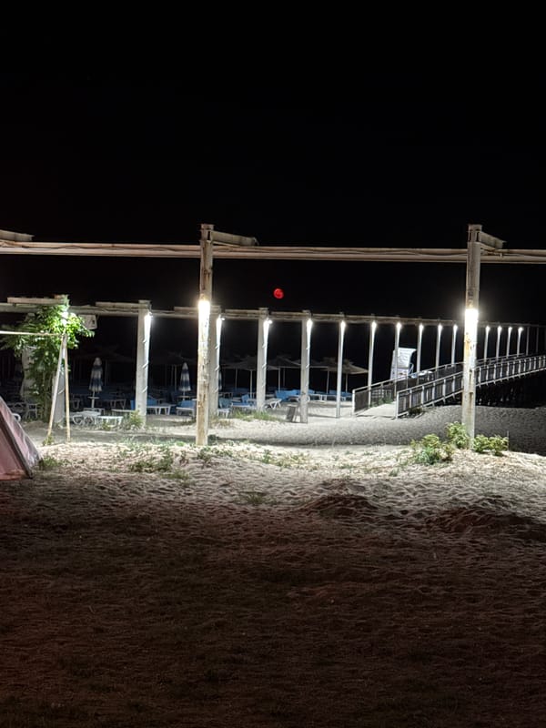 Full moon night at the beach, pier, and shoreline