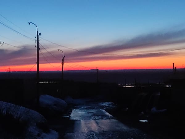 Dusk street scene captured with colorful sky transition