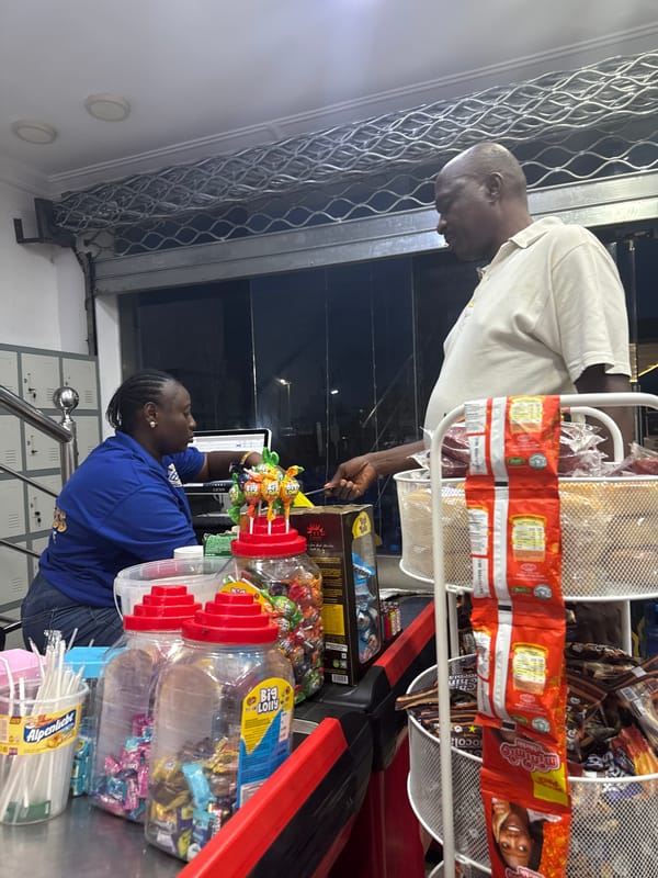 Evening activity around a kiosk in Ado, Nigeria