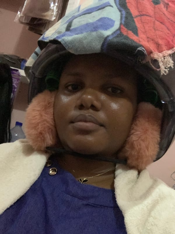 Woman receives hair treatment at Dar es-Salaam salon