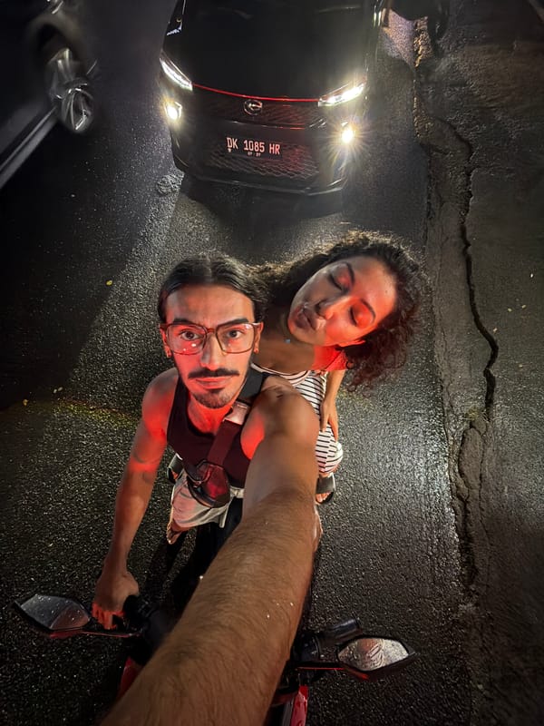 Couple takes nighttime selfies on Mengwi street