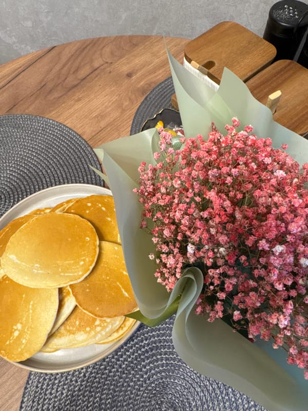 Domestic moments captured in Yakhroma home: cooking, flowers, pet