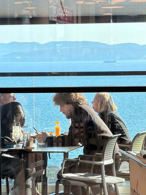 Cafe interior overlooking Kvarner Gulf waterfront in Rijeka