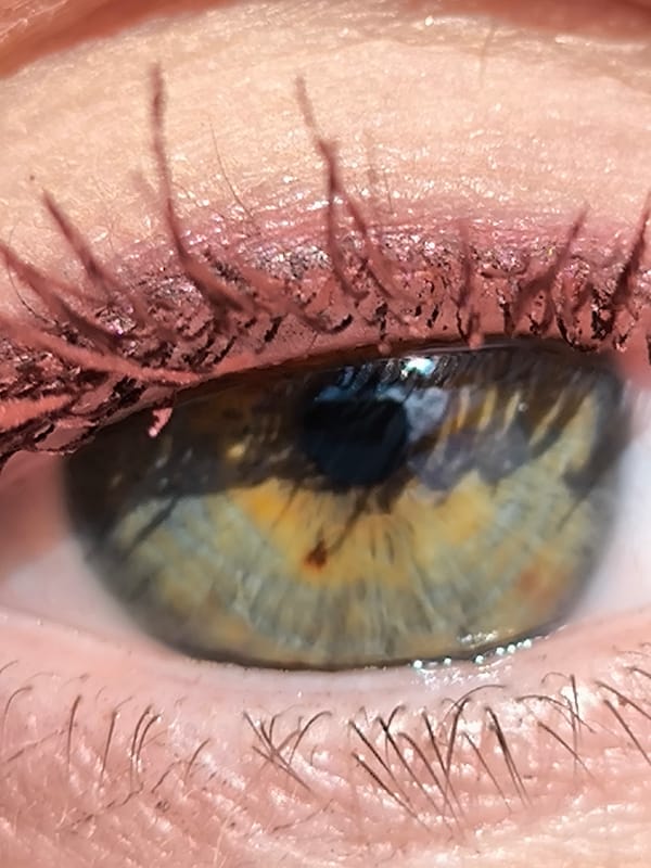 Close-up portrait photography session captures woman's distinctive eye colors