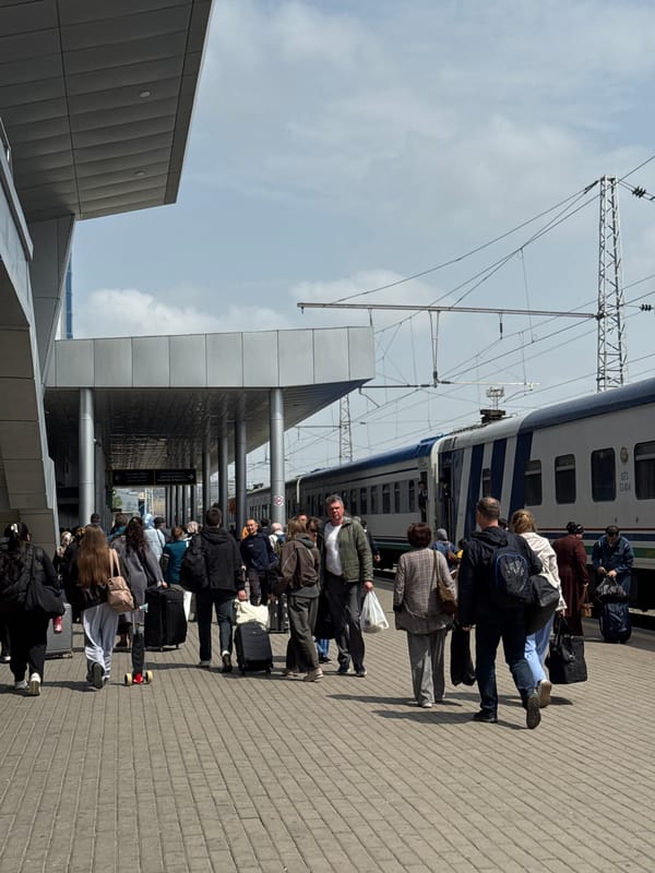 Morning commuters queue at Tashkent station for train departure