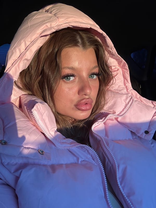 Woman takes selfie in pink jacket in Omsk