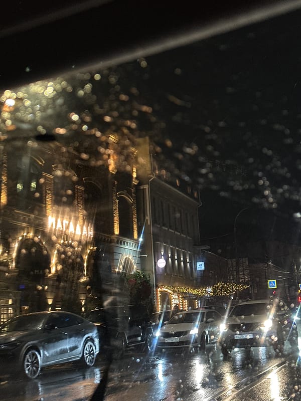 Illuminated building observed during rainy evening in Kuleshovka