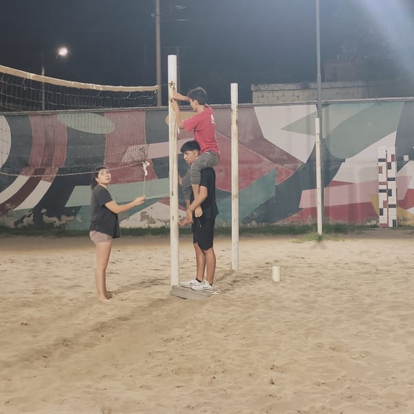 Nighttime beach volleyball court scene captured in Catamarca, Argentina