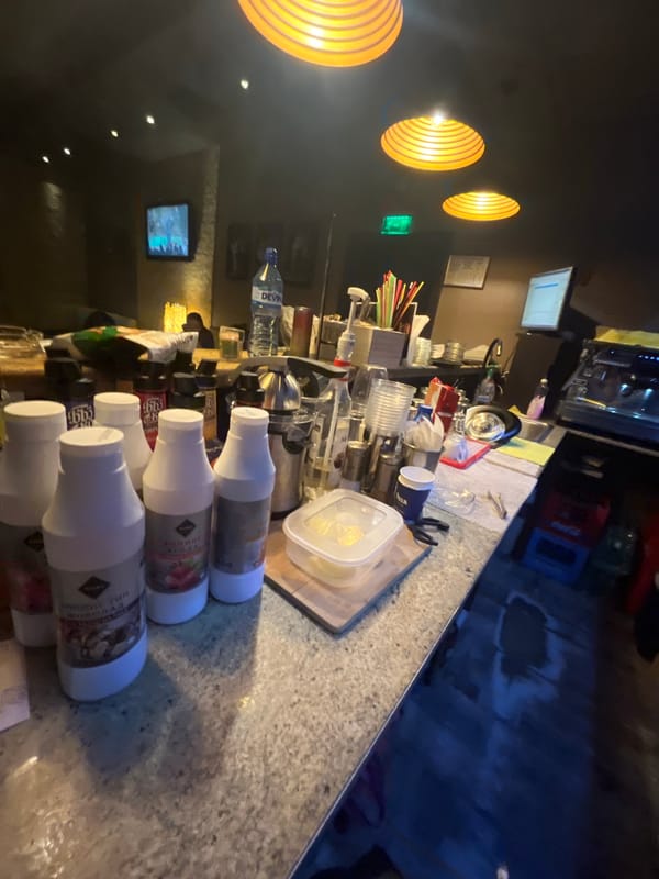 Cluttered bar counter observed in Svishtov, Bulgaria