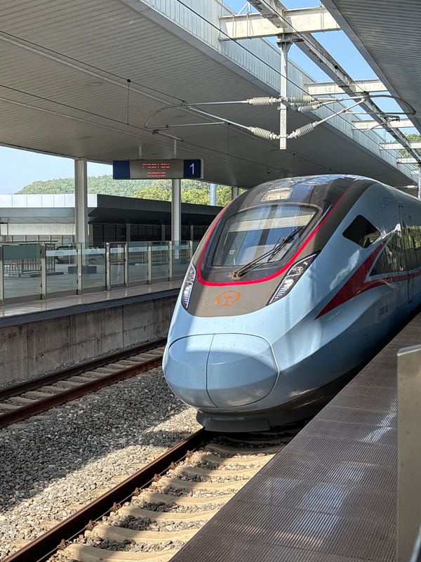 High-speed train at rest on a Jiyang District platform