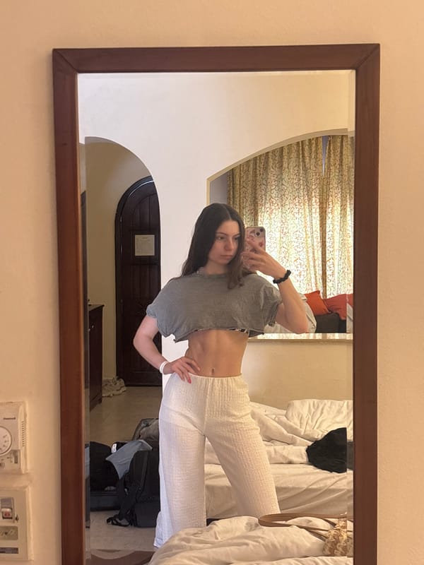 Woman takes mirror selfie in Sharm El Sheikh hotel room