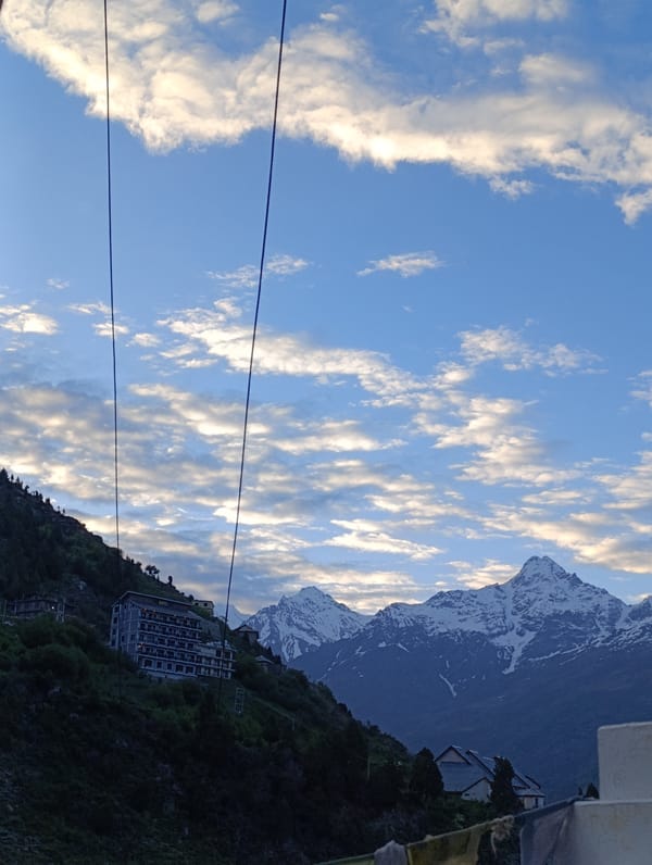 Buddhist stupas and snow peaks in the Himalayas near Kardang