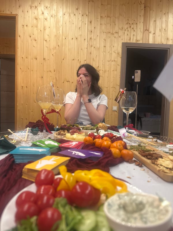 Woman enjoys moment at food-covered table with fresh produce